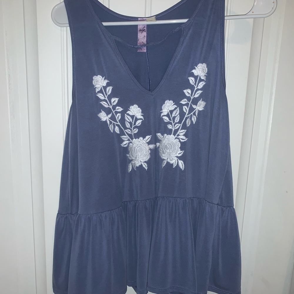Light blue flowy top with white flower details